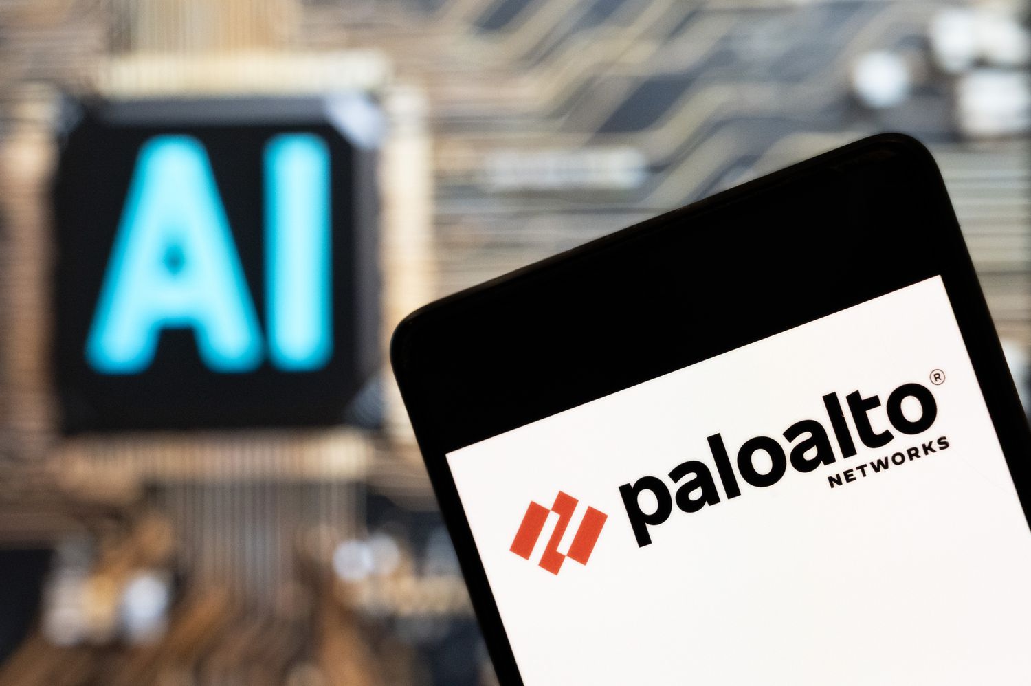 The American multinational cybersecurity company Palo Alto Networks logo seen displayed on a smartphone with an artificial intelligence (AI) chip and symbol in the background