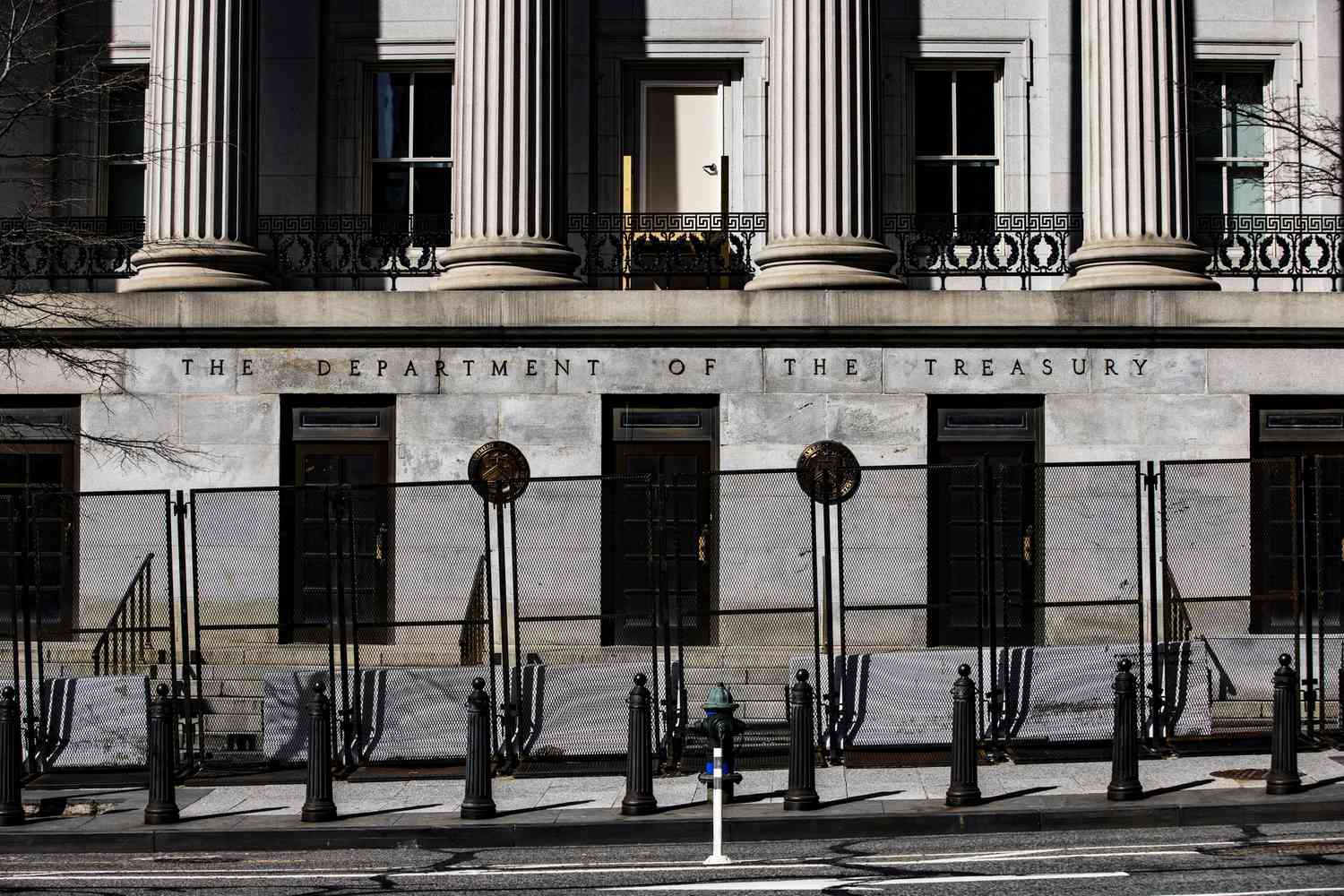 Signage outside the U.S. Treasury building in Washington, D.C., U.S., on Friday, March 19, 2021.