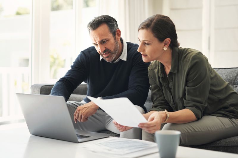 Two People Review on Laptop Screen