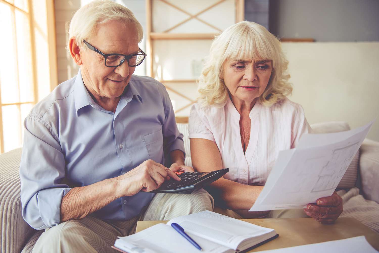 Couple with calculator and papers