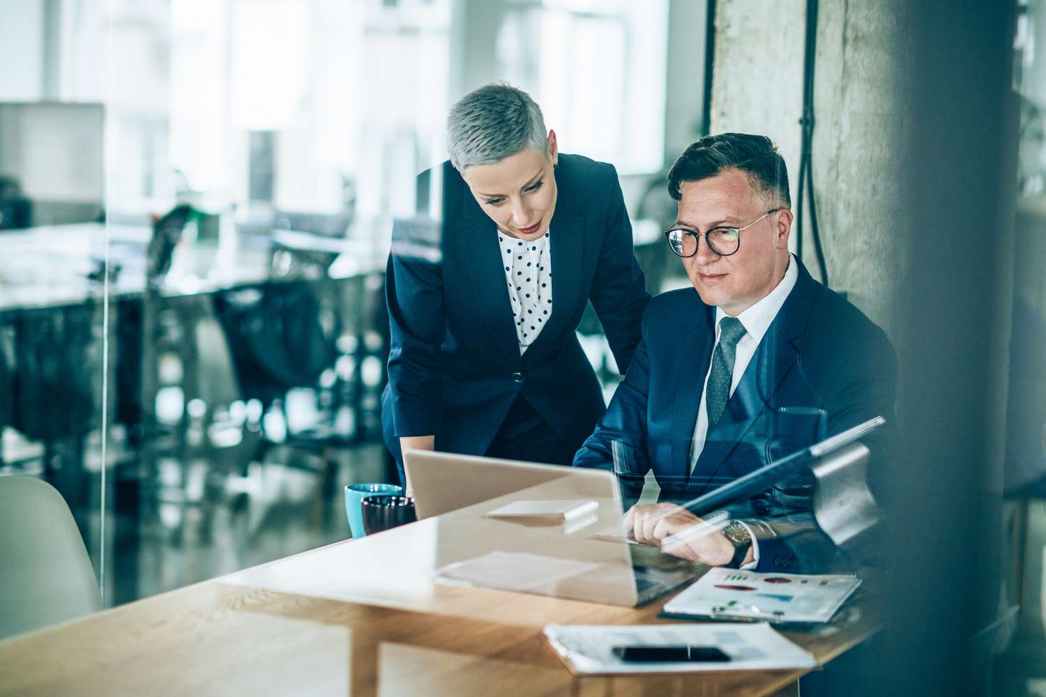 Two traders looking over the mortgage allocations