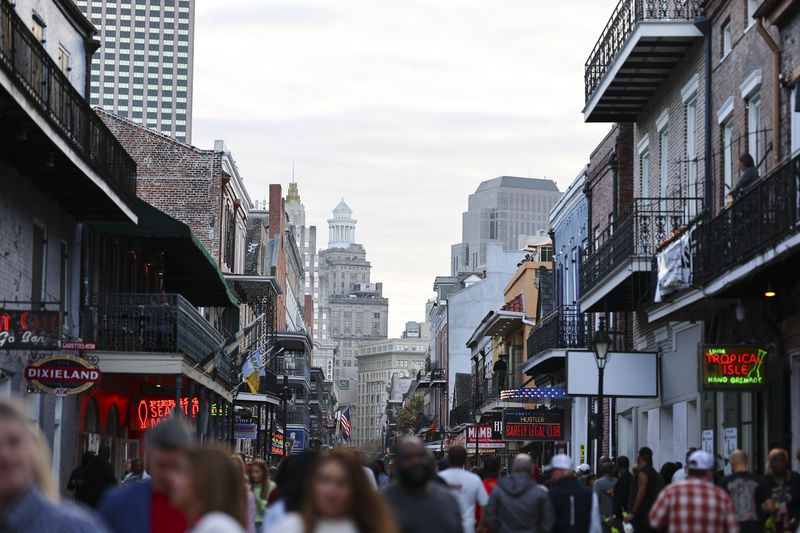 A general view of Bourbon Street as pedestrians walk the street in the French Quarter on December 14, 2024 in New Orleans, Louisiana.