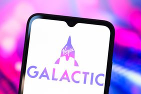 The Virgin Galactic logo is seen displayed on a smartphone screen