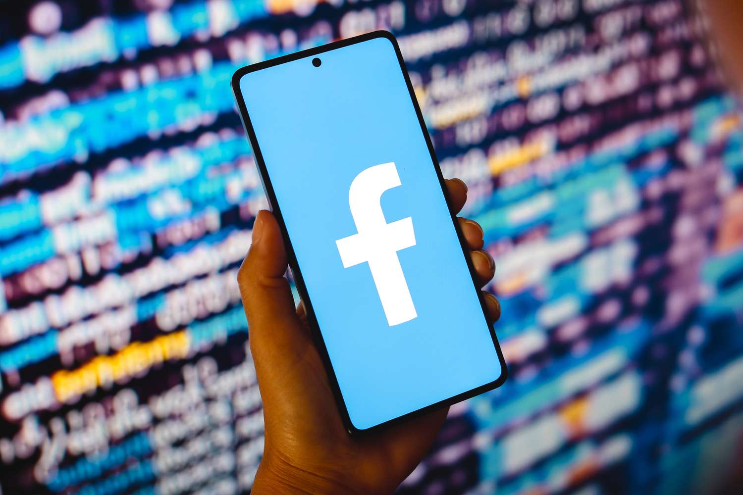 An illustration of the Facebook logo displayed on a mobile device. 