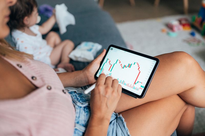 Woman looking at a chart on a mobile platform