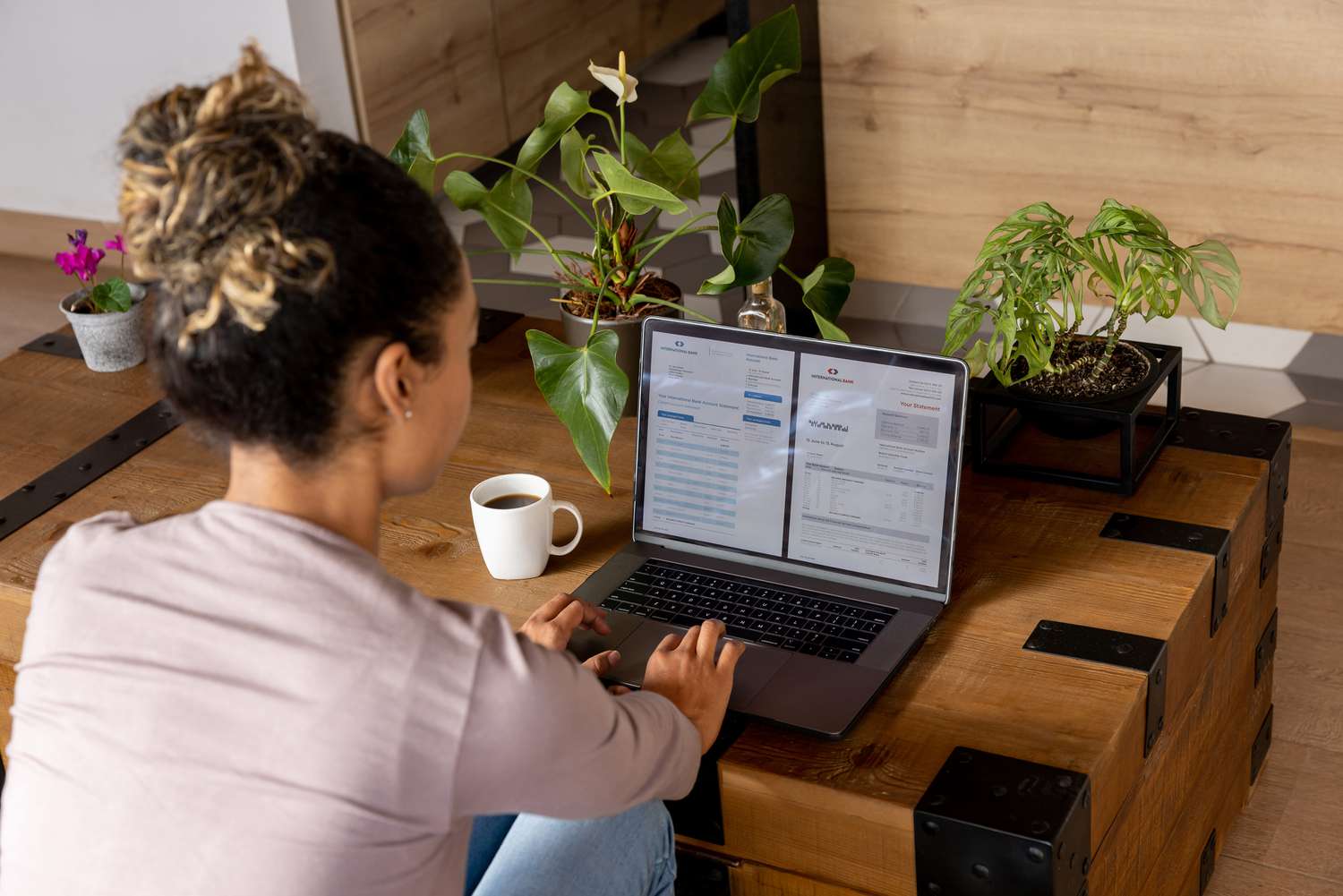 Woman at home checking her CD statements online