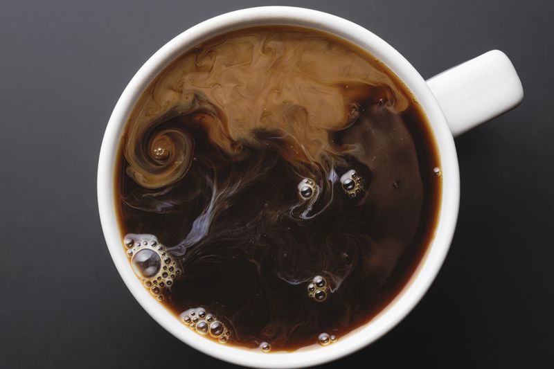 Coffee cup with coffee viewed from above