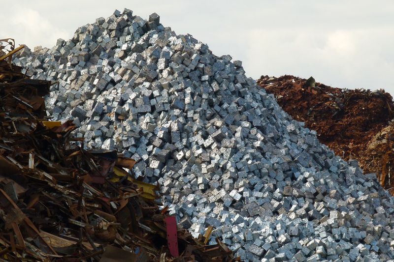 Scrap Mountain. Rough scrap, cubed metal and metal swarf ready for loading onto a bulk carrier at Liverpool Alexandra Branch Dock, Liverpool, 19.03.11.