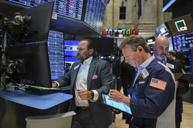 raders work on the floor of the New York Stock Exchange