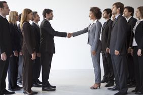 Business leaders shaking hands in agreement.