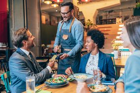 A businessman paying for a lunch