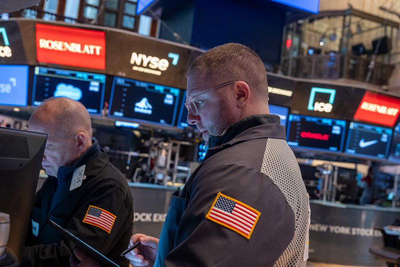 Traders work on the floor of the New York Stock Exchange