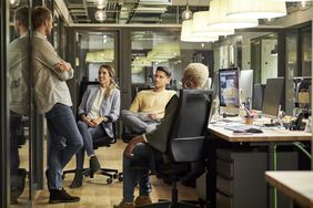 Business people discussing in creative office