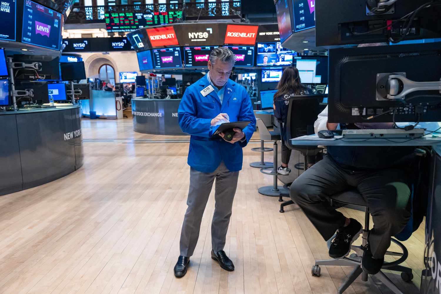 Traders work on the floor of the New York Stock Exchange.