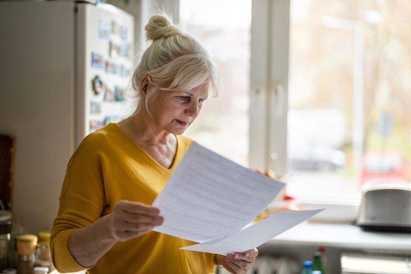 A woman reviews documents.