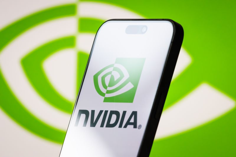 The logo of NVIDIA is displayed on a smartphone screen, with the company's signature green branding visible in the background
