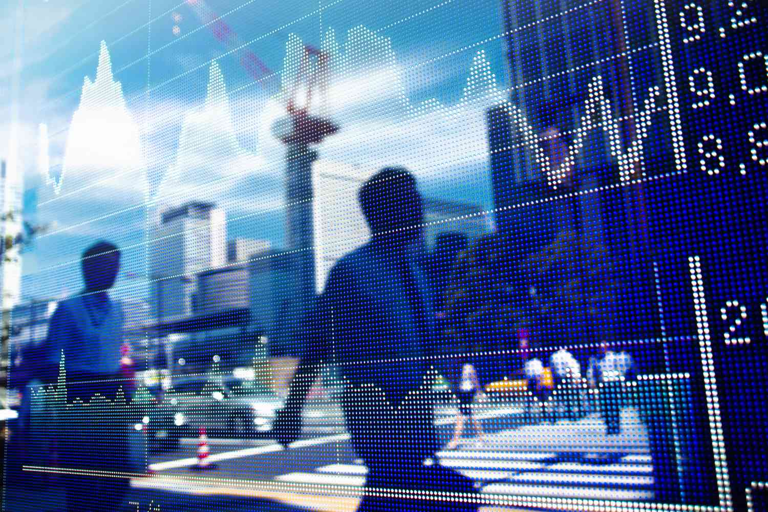 Shadows of passersby on a stock chart.