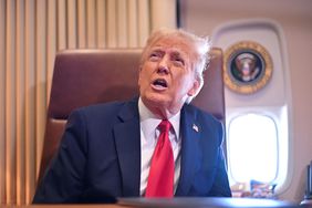US President Donald Trump speaks to the press aboard Air Force One