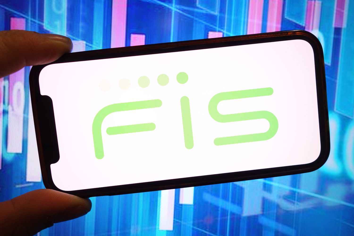 The green "FIS" Fidelity National Information Services logo is seen on a phone screen in front of a blue and red background.