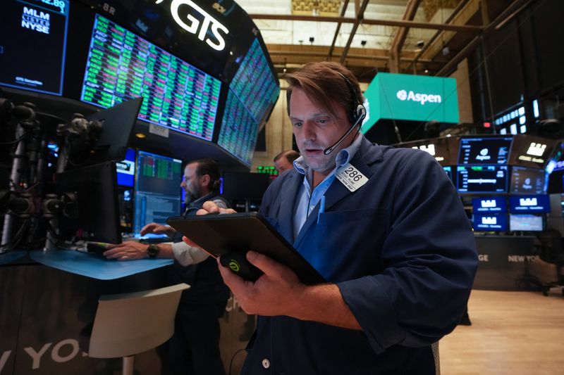 Traders work on the floor of the New York Stock Exchange
