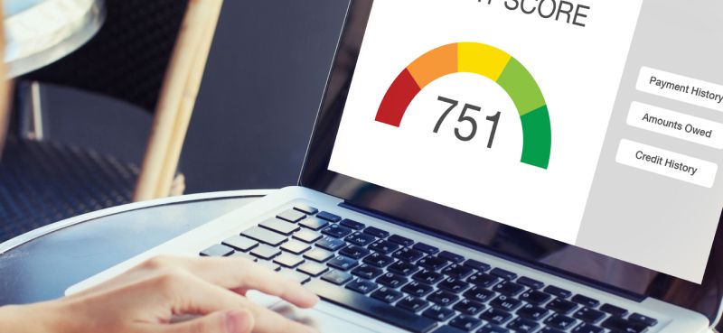 Laptop showing a credit score of 751