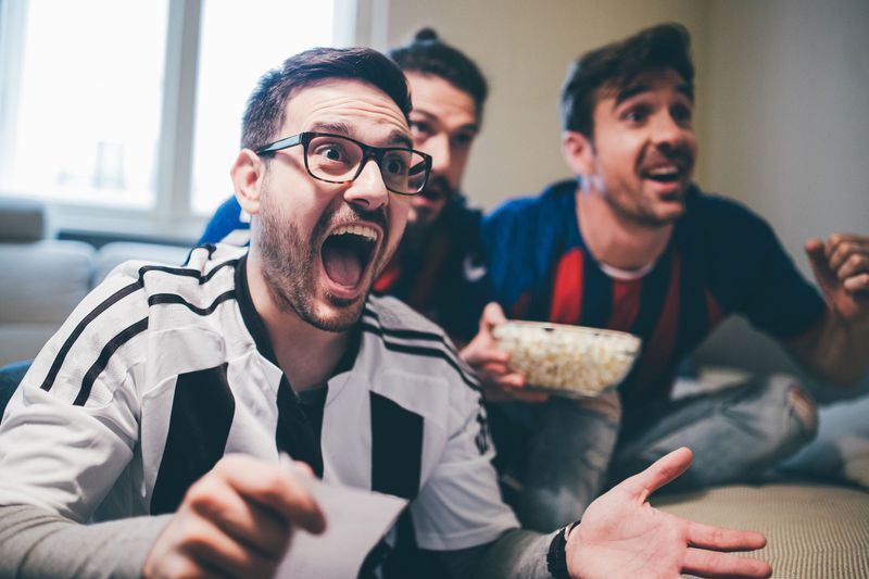Group of men watching a game