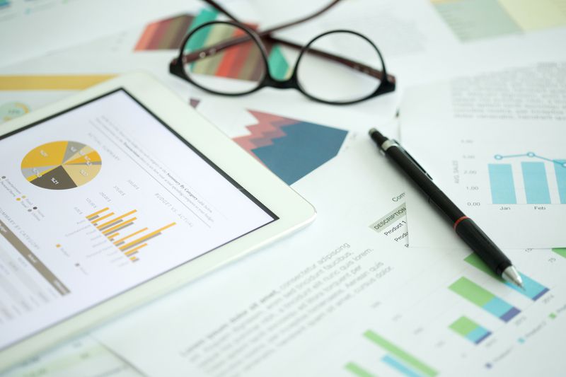 A desk full of financial documents.