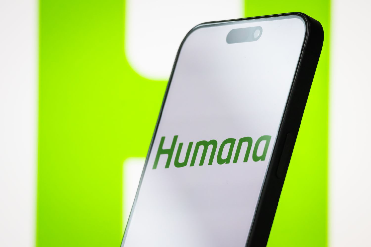 Humana logo is displayed on a smartphone screen