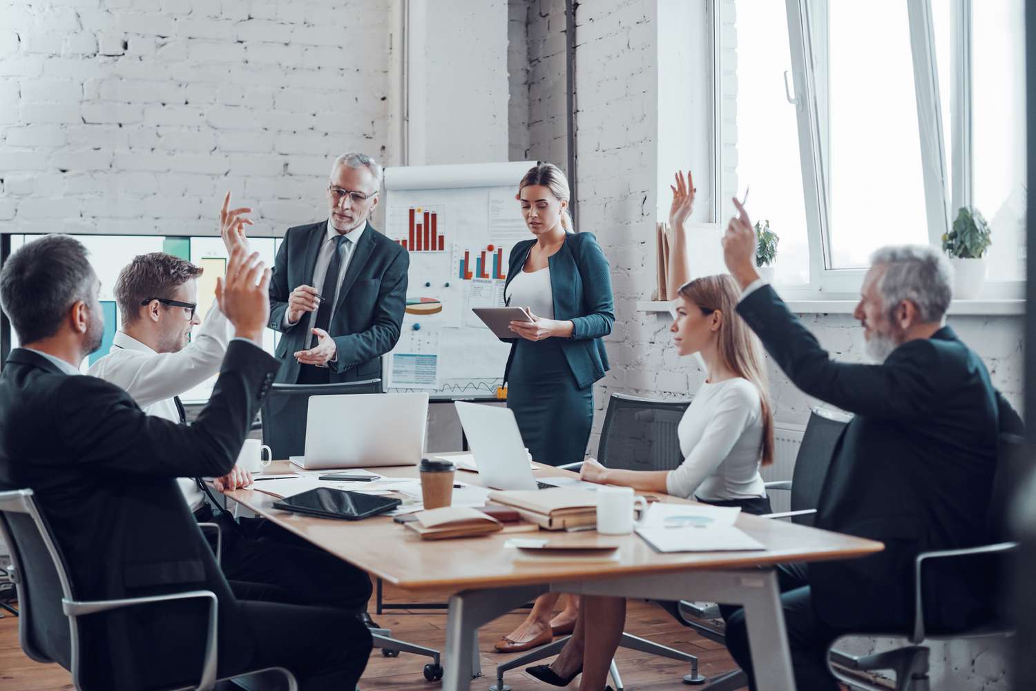 Shareholders voting in a business meeting