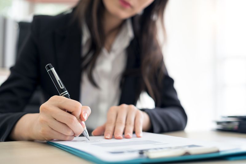 A financial officer signs an SEC form to withdraw pending security registration for their company.