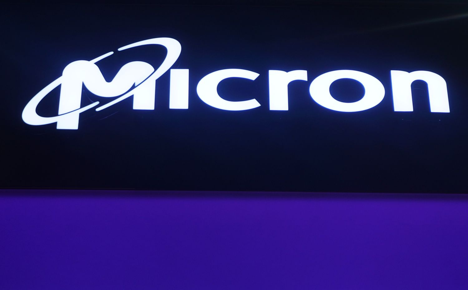 A Micron logo on display at an event.