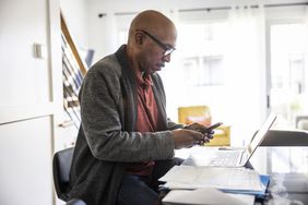 A man uses a smartphone.