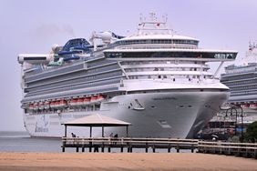 People look at the Carnival Adventure cruise ship moored at Melbourne's Station Pier on March 20, 2025