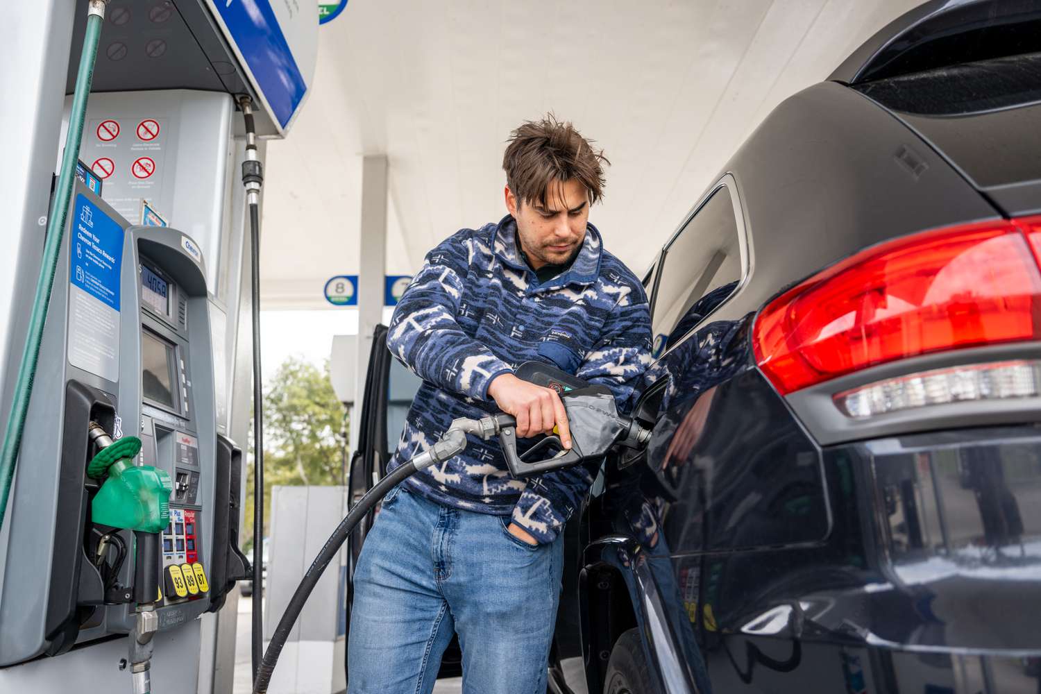 A customer pumps gas at a Chevron gas station on February 13, 2025 in Austin, Texas.