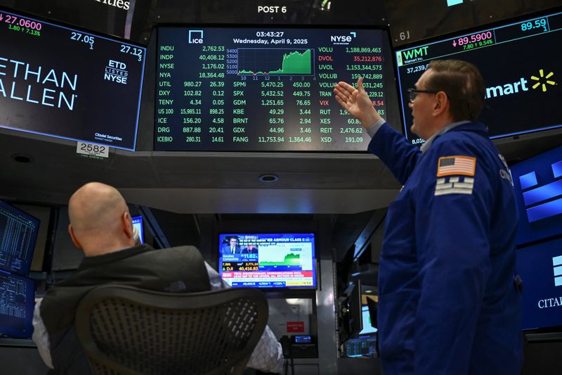 Traders work on the floor of the New York Stock Exchange