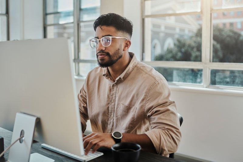 A man looking over the best crypto exchanges