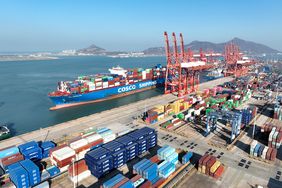 A COSCO container ship preparing to dock
