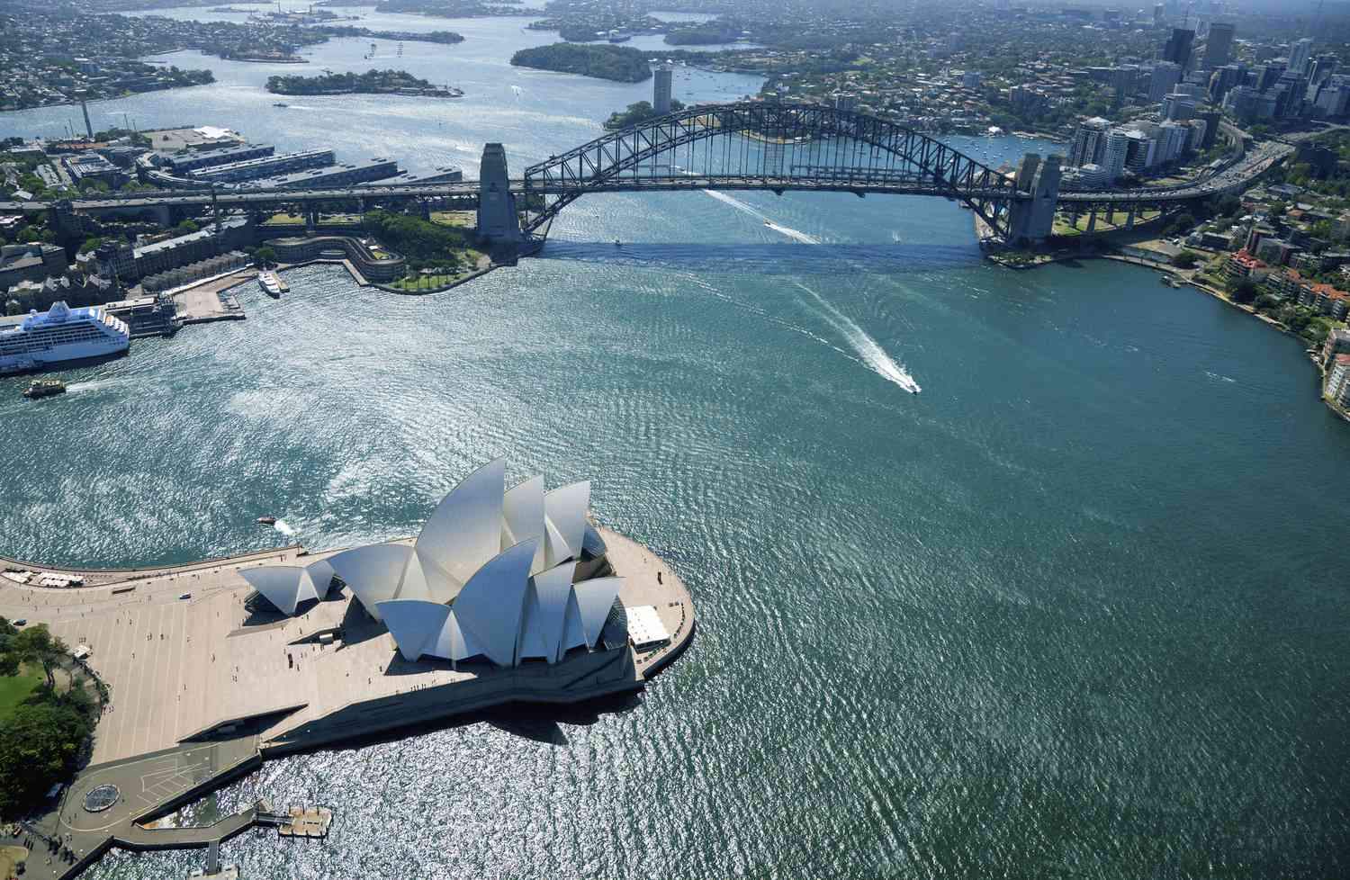 Aerial view of Sydney Harbour, Opera House, and Bridge.