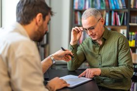 Man fills out debt consolidation paperwork