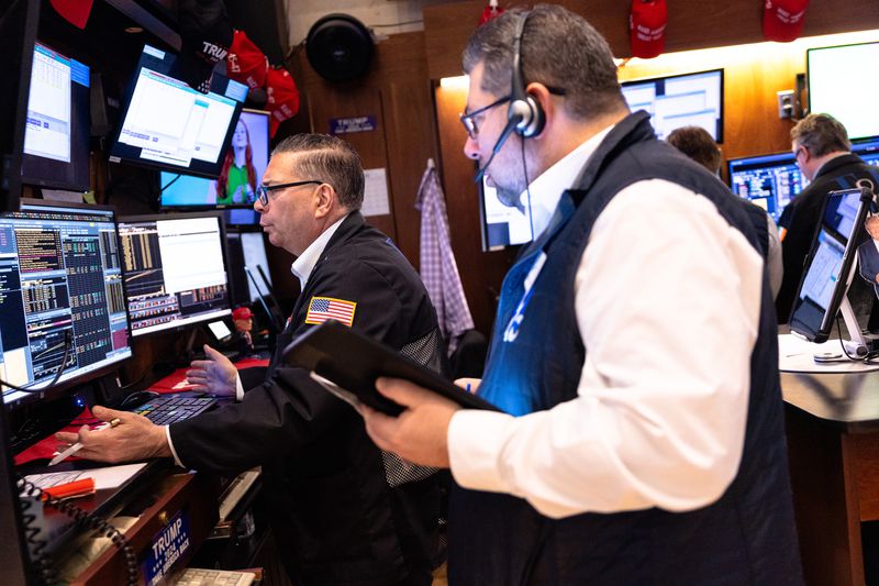 Traders work on the floor of the New York Stock Exchange