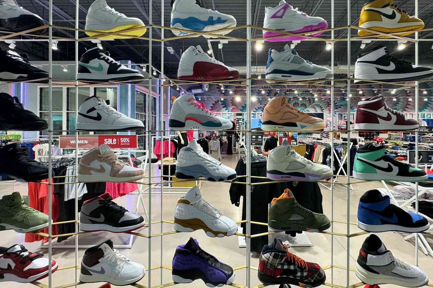 Nike shoes are displayed at a store.