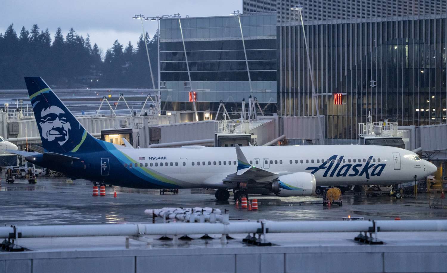 Alaska Airlines Boeing 737 MAX 9 plane sits at a gate at Seattle-Tacoma International Airport