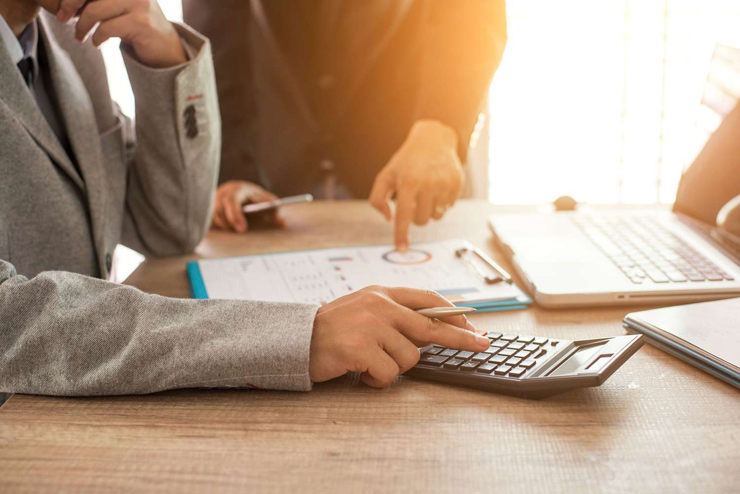Two Business People Calculate Their Business in the Office