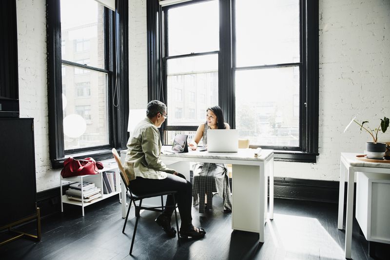 Woman in discussion with a financial advisor in an office