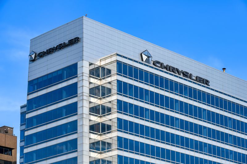 Business sign and logo of Chrysler on top of a modern building