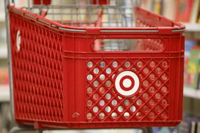 A red Target shopping cart with the white "bullseye" logo is seen in a Target store.