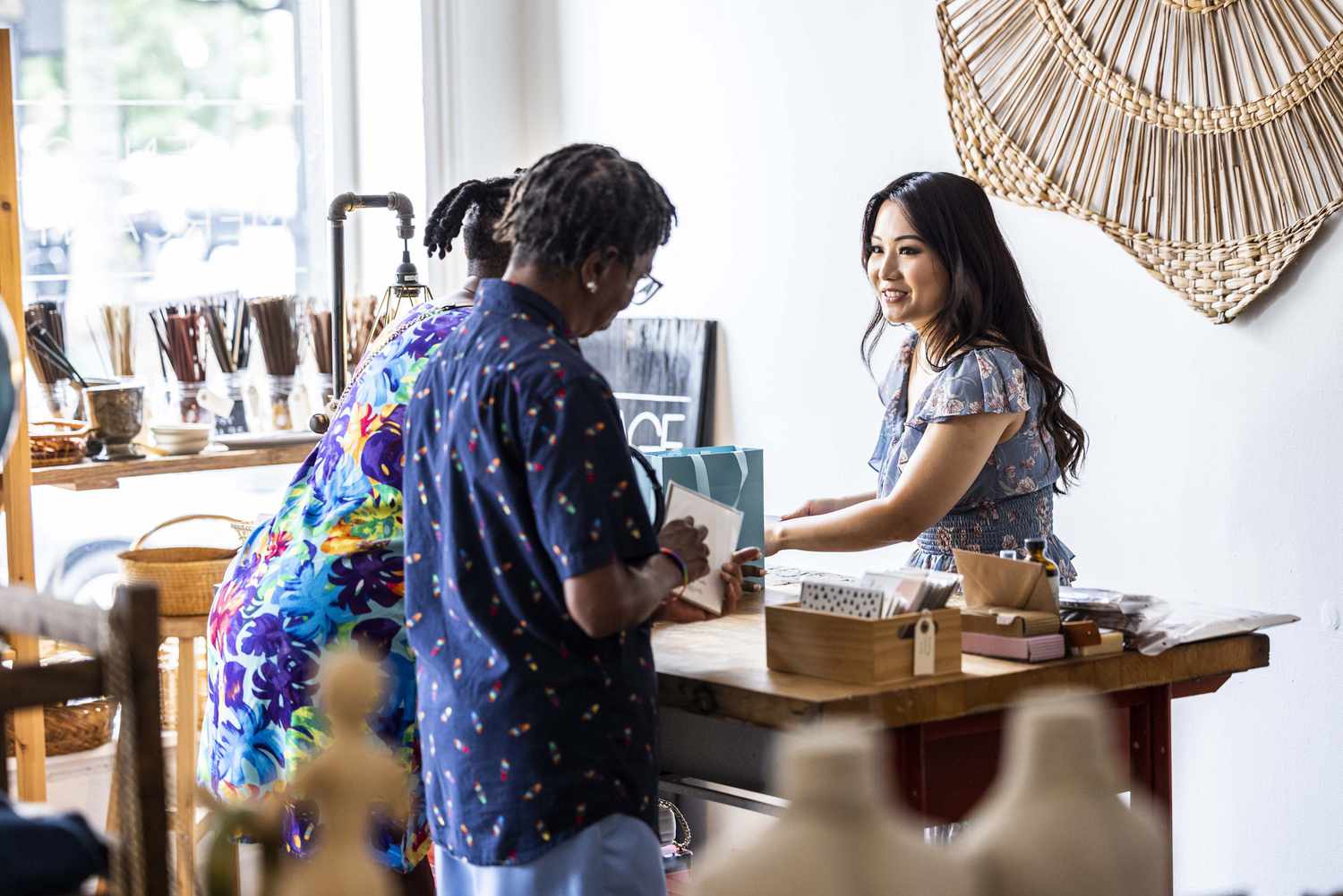 couple making a purchase at a female owned small business