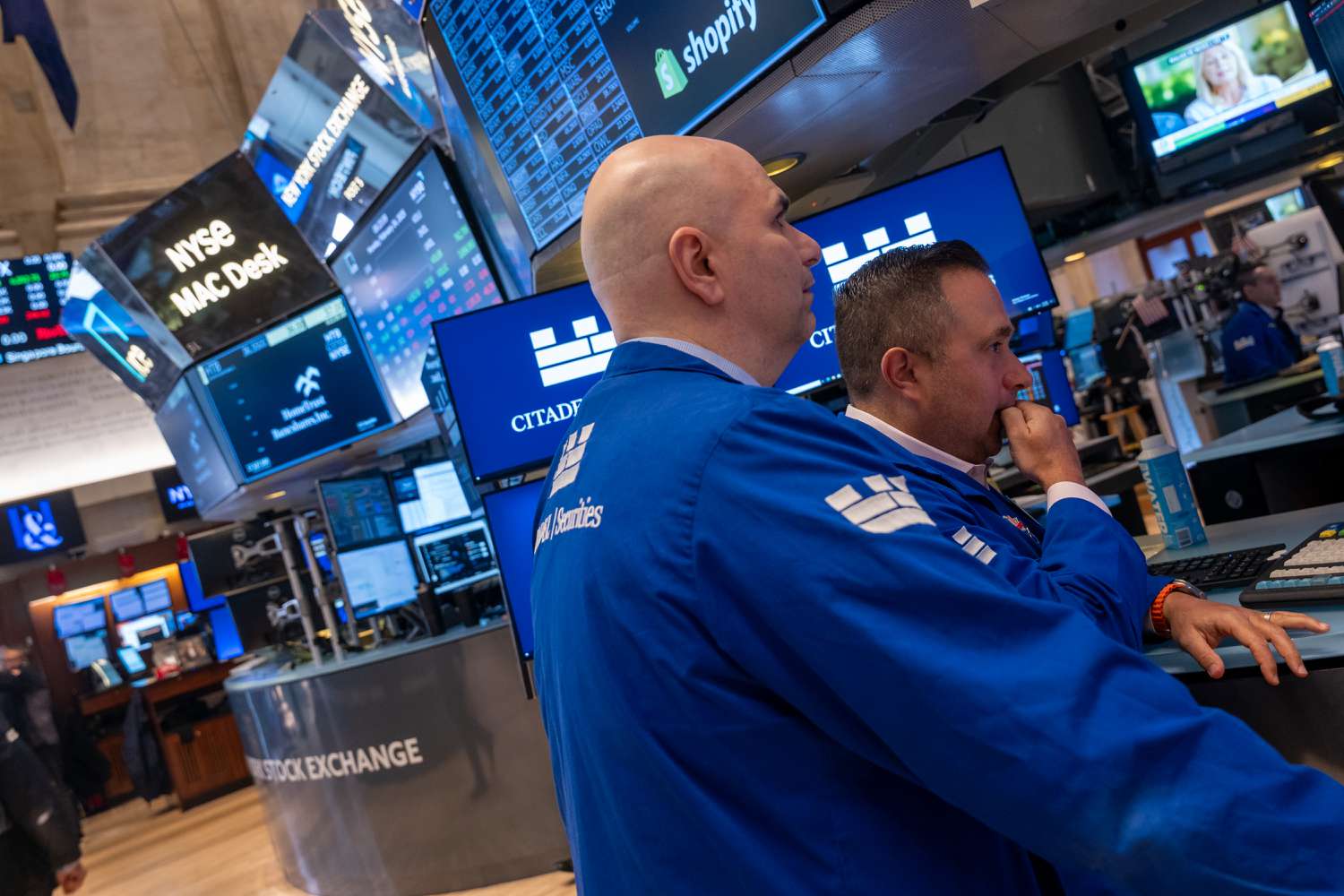 Traders work on the New York Stock Exchange