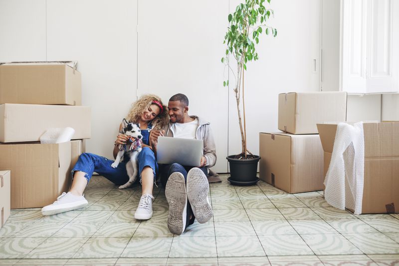 Couple updating their insurance after buying their first house