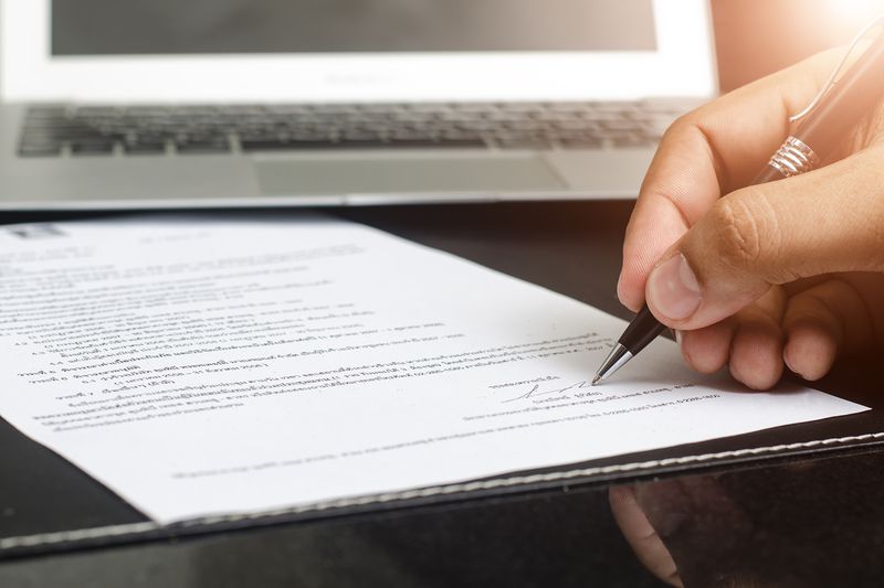 Man Signing Contract